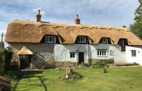 RJ Matravers Thatch Roof with patterned ridge